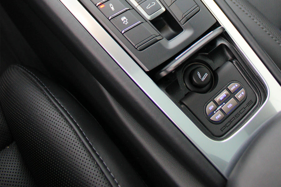Close up shot of a car interior controller panel