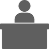 person at desk icon